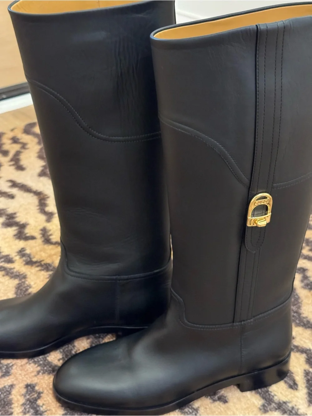 GUCCI Women’s Black Leather Knee-High Riding Boots with Gold Buckle